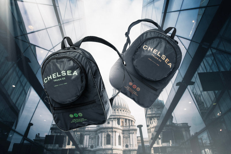 Reflective Backpack By Chelsea Truck Company In Black Color Printed With "white" & " Golden" Chelsea Truck Company Logo