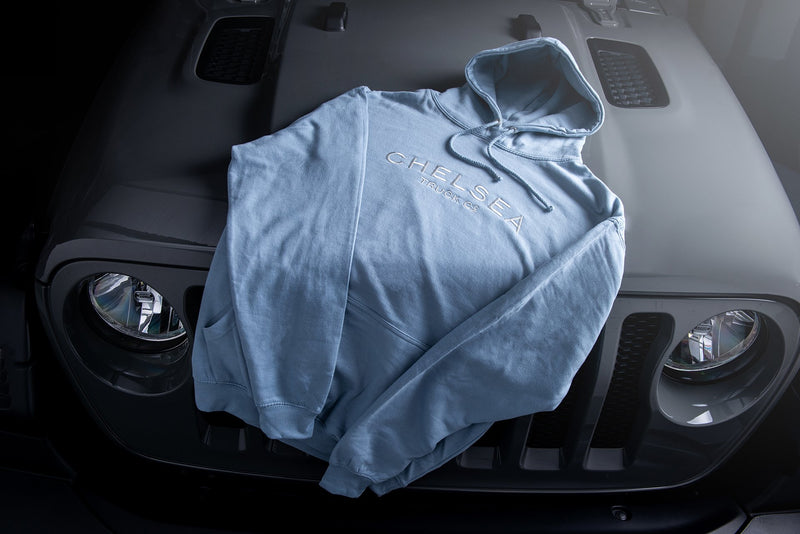 Dusty Blue with White Embroidery Hoodie On Black Jeep 