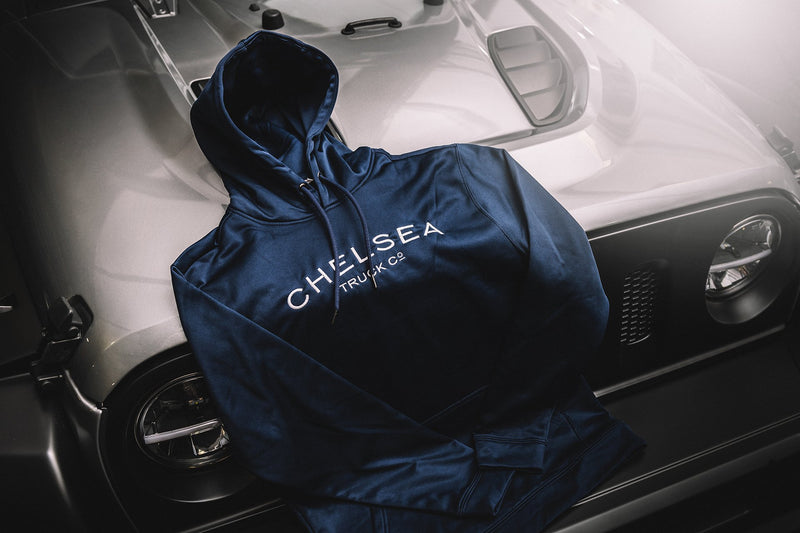 Navy Blue with White Embroidery Chelsea Truck Co Hoodie On Grey Car 