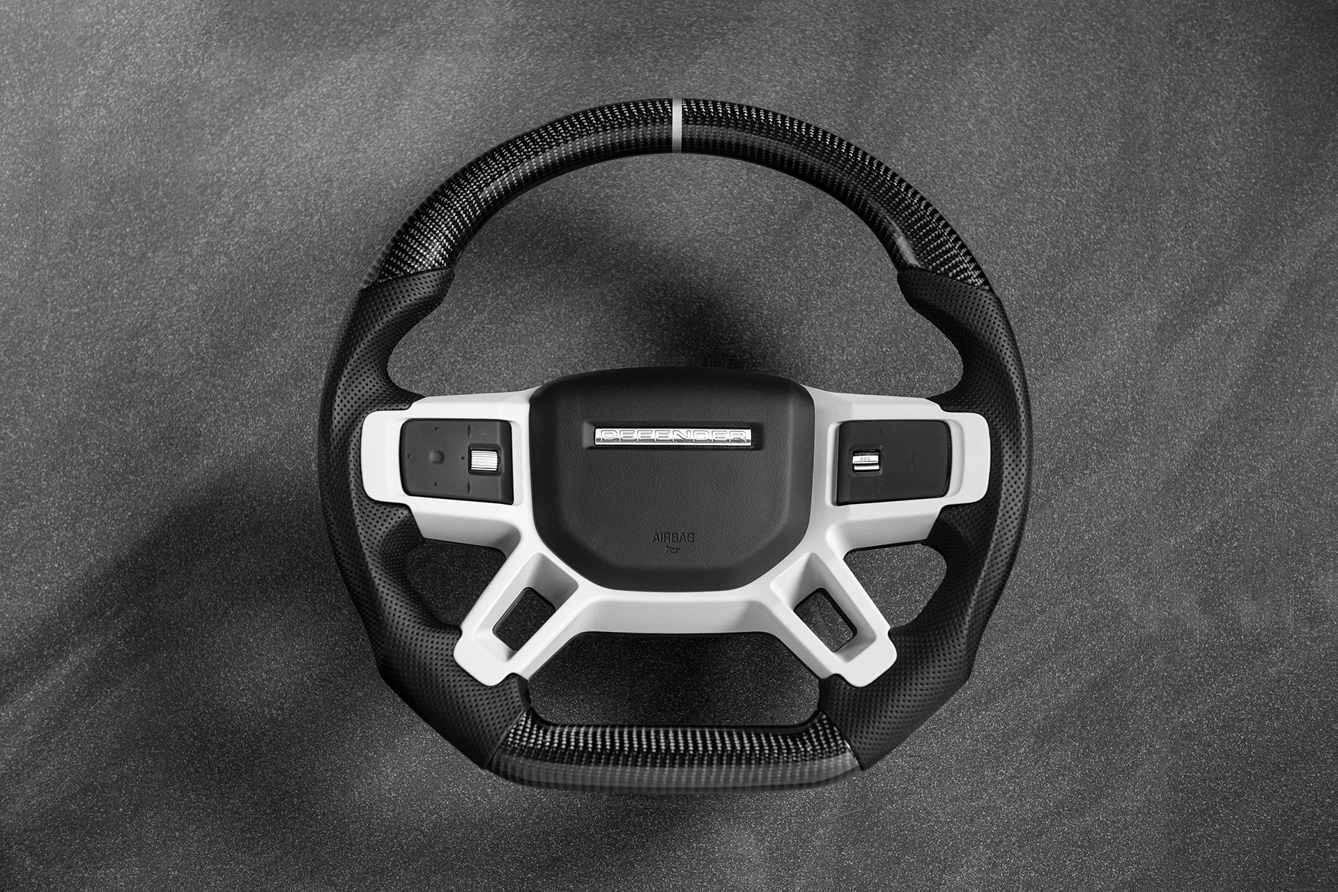 Carbon Steering Wheel On The Land Rover Defender 