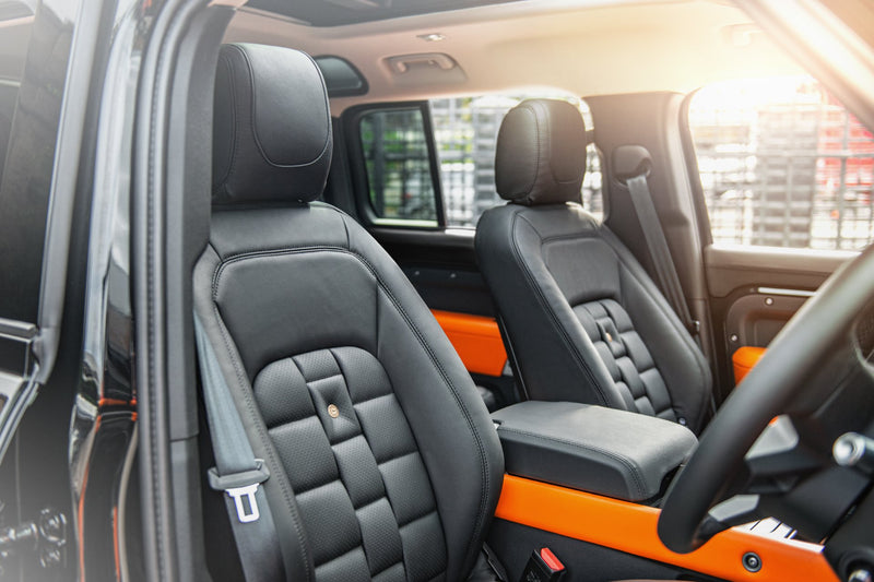 Side View Of The Defender 110 Interior In Black & Orange