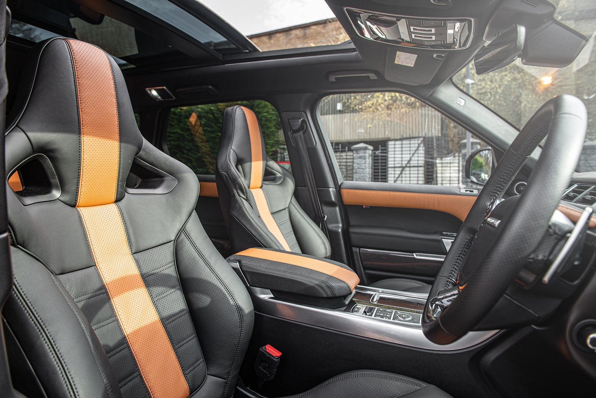 Tan & Black Leather Interior With leather Seat, Steering Wheel, Instrument Binnacle, Door Panel, Roof and Controls Tailored By kahn 