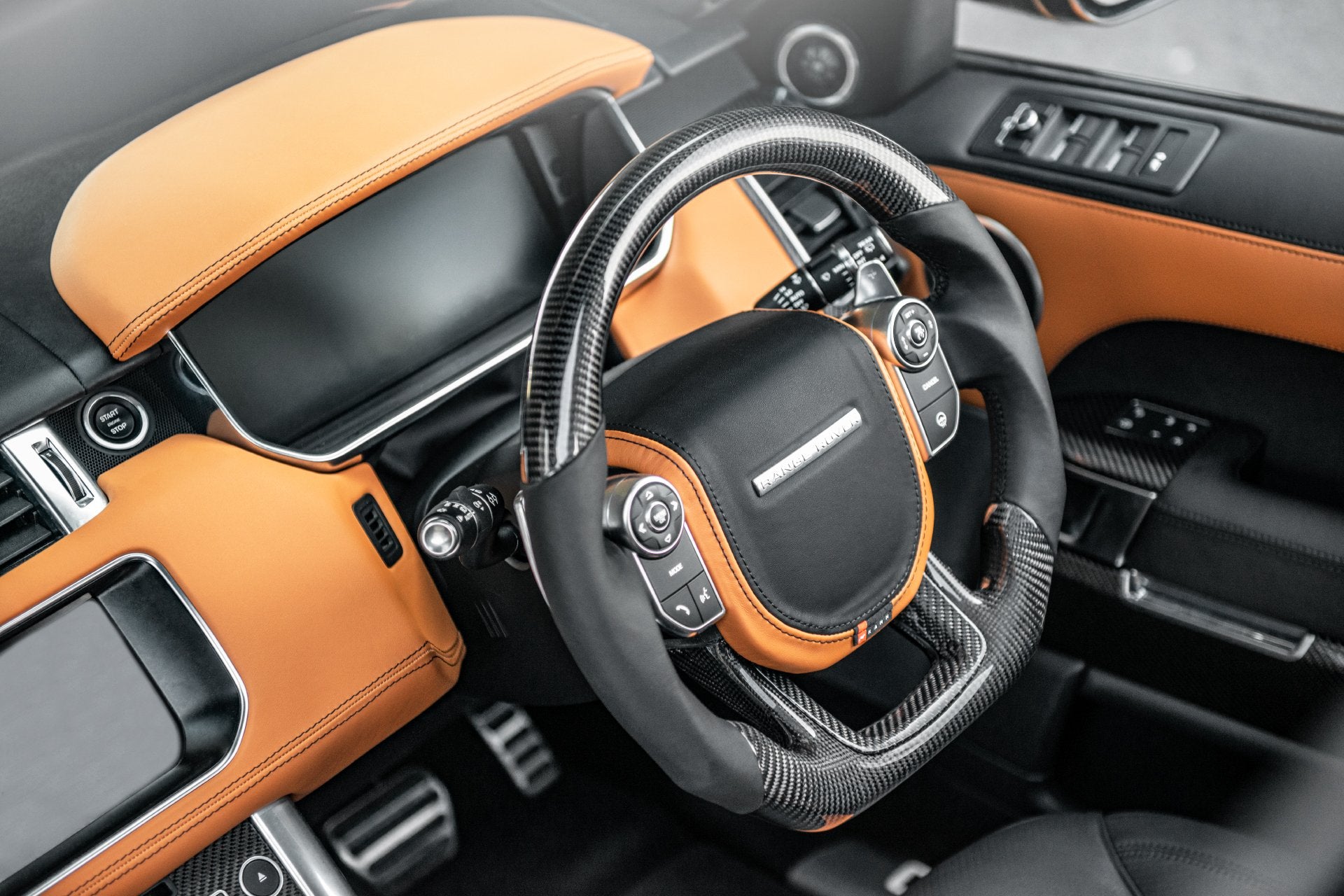 wider view of the range rover sport carbon fiber steering wheel
