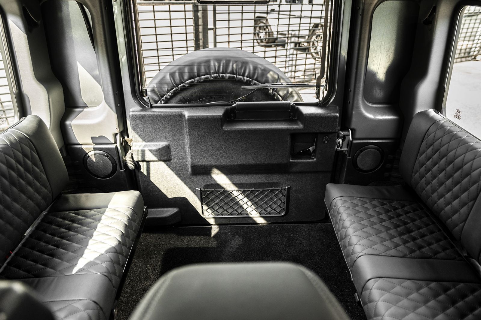 Defender Sitting Land Rover Defender | Rear Bench Conversion | Kahn - Project Kahn