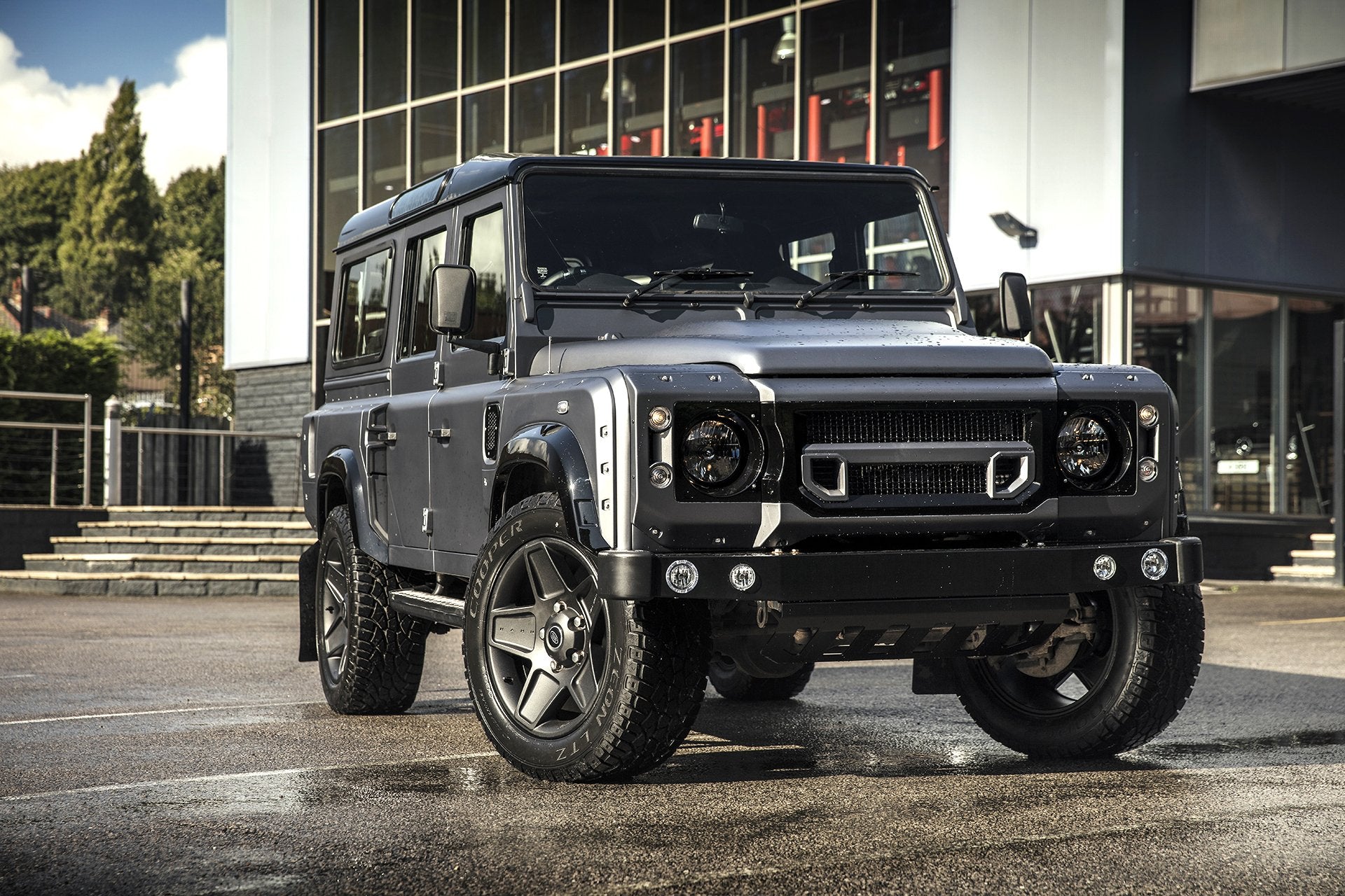 Black Defender 110 Tailored With The Front Bumpers, shield & The Wheels 
